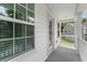 Charming front porch with white trim and pleasant view at 9713 Cutleaf Dr, Ladson, SC 29456