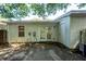Image of the home's back exterior featuring double doors, a window, and siding at 102 Sandy Hook Ct, Summerville, SC 29486