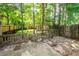 View of fenced-in backyard featuring a wood fence, mature trees, and minimal landscaping at 102 Sandy Hook Ct, Summerville, SC 29486