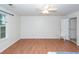 Spacious bedroom with ceiling fan, wood-look floors, and closet at 102 Sandy Hook Ct, Summerville, SC 29486