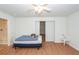 A small bedroom is enhanced with wood-look flooring, a bed, and a ceiling fan at 102 Sandy Hook Ct, Summerville, SC 29486