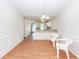 Bright dining room with chandelier and wood flooring, perfect for entertaining at 102 Sandy Hook Ct, Summerville, SC 29486