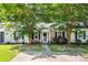 Charming single-story home with brick facade, black shutters, and inviting landscaping at 102 Sandy Hook Ct, Summerville, SC 29486