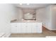 Open-concept kitchen with breakfast bar, seamlessly leading to dining area at 102 Sandy Hook Ct, Summerville, SC 29486