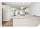 Open-concept kitchen with breakfast bar, seamlessly leading to dining area at 102 Sandy Hook Ct, Summerville, SC 29486