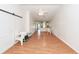 Open-concept living room into kitchen space with bright walls and ceiling fan at 102 Sandy Hook Ct, Summerville, SC 29486
