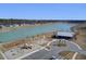 A stunning aerial view showcases a community with lake, playground, amenity center and parking at 104 Wild Orchid Way, Huger, SC 29450
