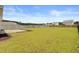 Private backyard featuring a lush lawn and a concrete patio, ideal for outdoor entertaining at 104 Wild Orchid Way, Huger, SC 29450