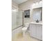 Bathroom featuring a toilet, vanity with sink, and a shower with glass doors at 104 Wild Orchid Way, Huger, SC 29450