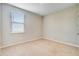 Cozy bedroom with neutral walls, carpet, and a window with blinds at 104 Wild Orchid Way, Huger, SC 29450