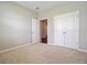 Bright bedroom with carpet, double door closet, and connecting door at 104 Wild Orchid Way, Huger, SC 29450