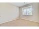 Simple bedroom with neutral walls, carpet flooring, and a window with blinds at 104 Wild Orchid Way, Huger, SC 29450
