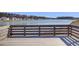 Relaxing waterfront scenery from the wooden dock overlooking the tranquil community lake at 104 Wild Orchid Way, Huger, SC 29450