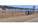 Fenced dog park area offering a secure space for pets with lake views and convenient waste disposal at 104 Wild Orchid Way, Huger, SC 29450