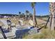 Community fire pit with seating near the playground and lake enhancing the outdoor recreation at 104 Wild Orchid Way, Huger, SC 29450