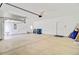 Clean and spacious two-car garage with ample storage space, perfect for vehicles and equipment at 104 Wild Orchid Way, Huger, SC 29450