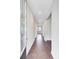Long hallway featuring hardwood floors and recessed lighting at 104 Wild Orchid Way, Huger, SC 29450