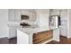 Stylish kitchen with marble countertops, stainless steel appliances, and a modern gas range at 104 Wild Orchid Way, Huger, SC 29450