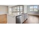 Large kitchen island with sink and stainless steel dishwasher providing ample room to work at 104 Wild Orchid Way, Huger, SC 29450