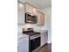 Modern kitchen with stainless steel appliances, gas range, and stylish gray cabinetry at 104 Wild Orchid Way, Huger, SC 29450
