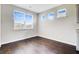 Bright living room with hardwood floors and plenty of natural light, perfect for relaxing at 104 Wild Orchid Way, Huger, SC 29450