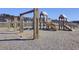 Wooden playground offers swings, slides, and other engaging activities, set in a Gathering-friendly community at 104 Wild Orchid Way, Huger, SC 29450