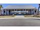 Community pool house featuring picnic tables and open design, creating a perfect relaxation spot at 104 Wild Orchid Way, Huger, SC 29450