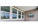 Covered porch with multiple windows and an outdoor television for entertainment at 104 Wild Orchid Way, Huger, SC 29450