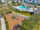 Community with pool, playground, green spaces and pedestrian walkways lined with palm trees at 107 Cotton Blossom Way, Summerville, SC 29485