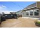 Backyard featuring a concrete patio, spa, and well-maintained landscaping, creating a comfortable outdoor living space at 107 Cotton Blossom Way, Summerville, SC 29485