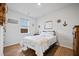 Bedroom featuring a queen-sized bed, decor, and natural light from a window, creating a cozy atmosphere at 107 Cotton Blossom Way, Summerville, SC 29485