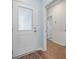 Bright entryway with hardwood floors and a white door with decorative glass at 107 Cotton Blossom Way, Summerville, SC 29485