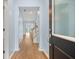 Inviting foyer with hardwood floors and views of the staircase and backyard at 107 Cotton Blossom Way, Summerville, SC 29485