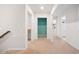 Bright hallway showcasing access to various rooms with a neutral carpet and walls, enhancing the flow of the home at 107 Cotton Blossom Way, Summerville, SC 29485