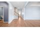 Open-concept living room with hardwood floors, staircase and light blue walls at 107 Cotton Blossom Way, Summerville, SC 29485