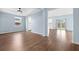 Spacious living room featuring hardwood floors, ample natural light, and neutral paint at 107 Cotton Blossom Way, Summerville, SC 29485