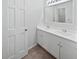 Bright bathroom with a double sink vanity, white cabinets and a large mirror at 109 Evance Ct, Summerville, SC 29485
