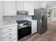 White kitchen featuring stainless steel appliances and countertops at 109 Evance Ct, Summerville, SC 29485