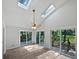 Bright sunroom with skylights, light hardwood floors, and ceiling fan at 109 Evance Ct, Summerville, SC 29485