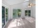 Inviting sunroom with multiple sliding doors to access the deck and backyard at 109 Evance Ct, Summerville, SC 29485