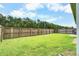 Expansive backyard with well-maintained lawn and a tall wooden privacy fence at 112 Mayfield Dr, Goose Creek, SC 29445