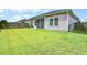 Well-maintained backyard features green lawn, privacy fence, screened in porch, and ample space at 112 Mayfield Dr, Goose Creek, SC 29445