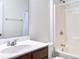 Bathroom with a shower and bathtub combination, single sink vanity, and a large mirror at 112 Mayfield Dr, Goose Creek, SC 29445