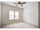 Bedroom with carpet, ceiling fan, and two windows with blinds for privacy and natural light at 112 Mayfield Dr, Goose Creek, SC 29445