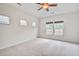 Cozy bedroom with soft carpet, ceiling fan, and well-lit windows offering outside views at 112 Mayfield Dr, Goose Creek, SC 29445