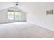 Spacious bonus room featuring vaulted ceiling, two windows, carpet, and ample natural light at 112 Mayfield Dr, Goose Creek, SC 29445