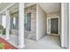 Welcoming front porch with brick accents leading to a stylish black front door at 112 Mayfield Dr, Goose Creek, SC 29445