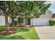 Inviting home with well-manicured lawn, mature tree, and a two-car garage at 112 Mayfield Dr, Goose Creek, SC 29445