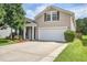 Charming two-story home featuring a spacious driveway and a two-car garage at 112 Mayfield Dr, Goose Creek, SC 29445