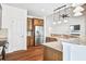 Contemporary kitchen with granite counters, stainless fridge, and seamless flow to living area at 112 Mayfield Dr, Goose Creek, SC 29445